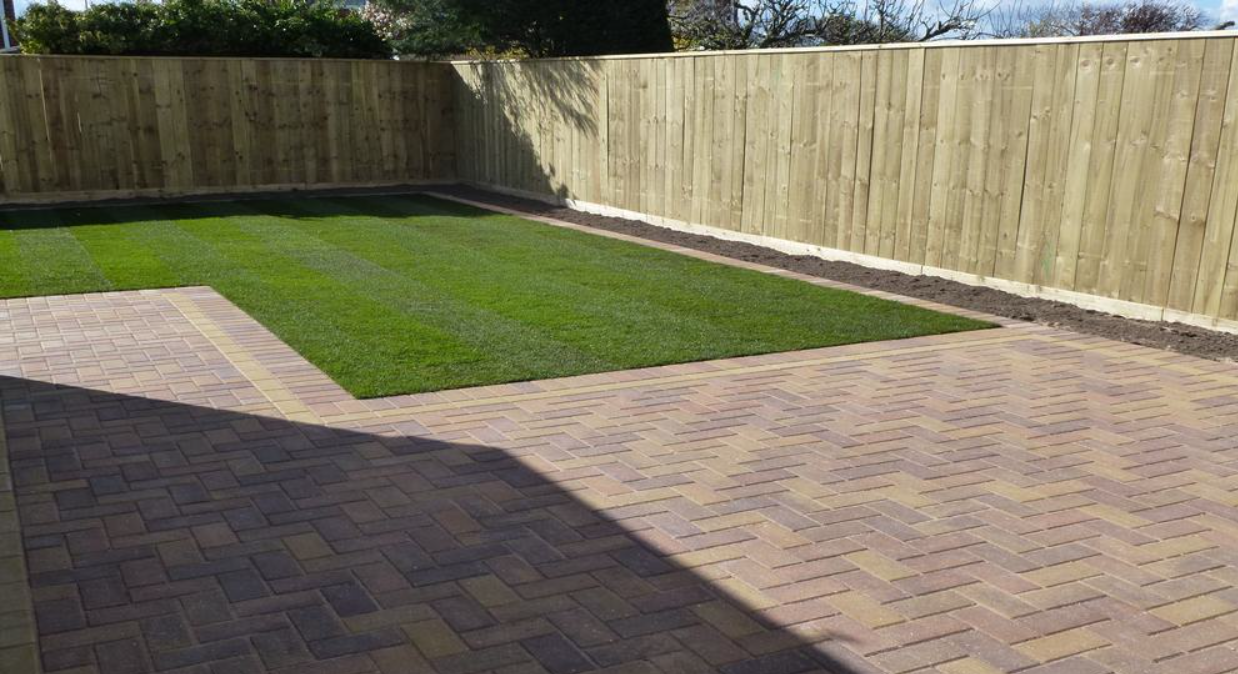 Block paving with artificial lawn laid by Connoisseur Paving